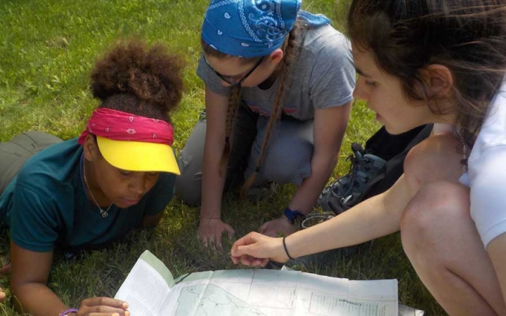 girls learn to navigate backpacking trip